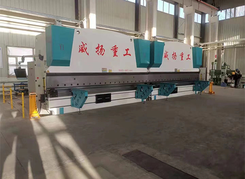 What safety features are incorporated in a combined punching and shearing machine to ensure operator safety?